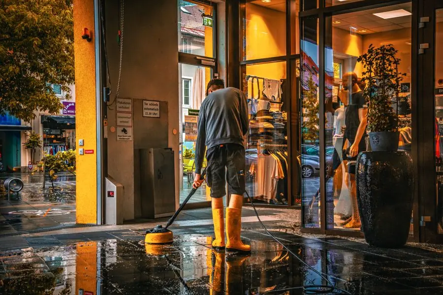 Removing water from the wet floor of a Sherman, TX business