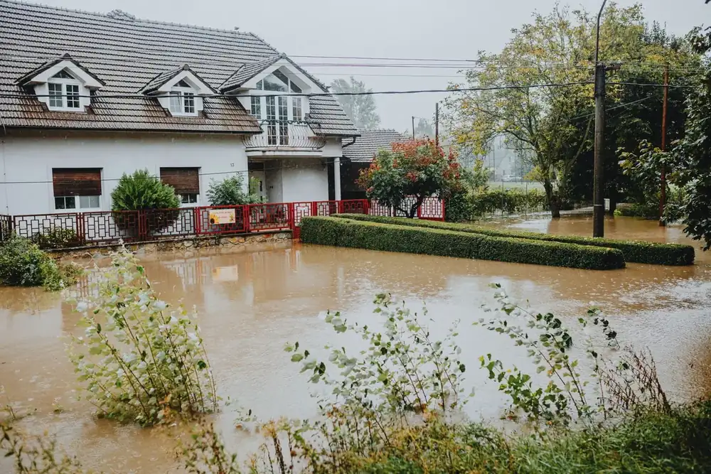 A home surrounded by storm floodwater in Sherman, TX after heavy rain