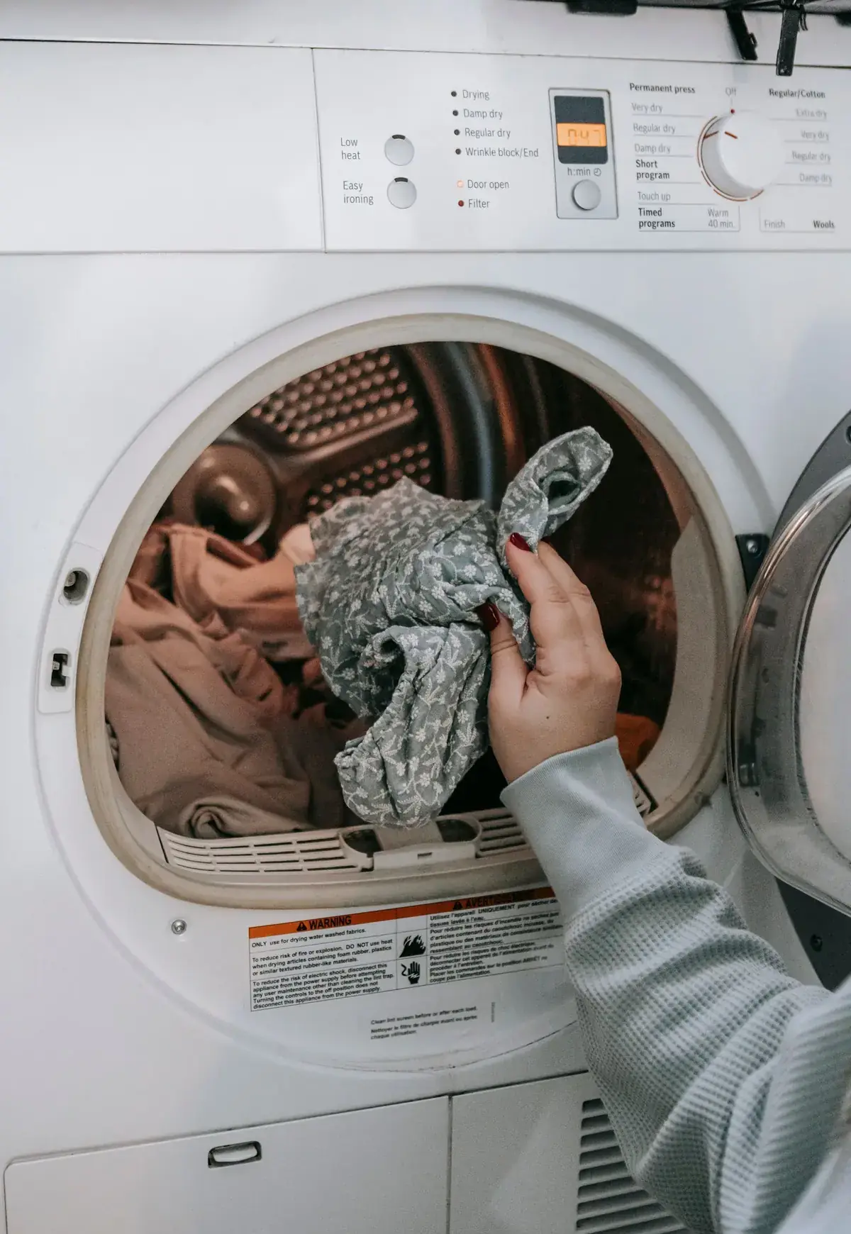 Loading a front-load washing machine in a Sherman, TX laundry room