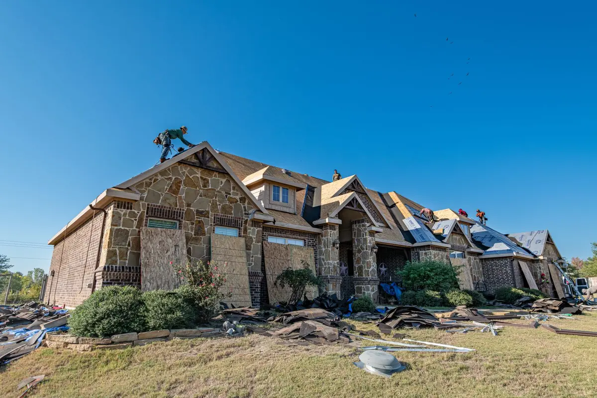 A Texas home being re-roofed after storm damage, Sherman, TX