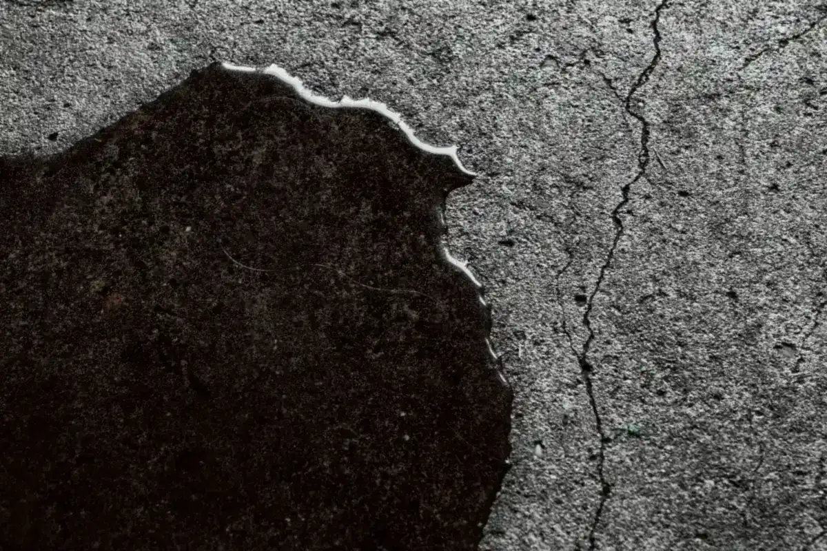 Water surfacing through a crack in a concrete slab in Sherman, TX